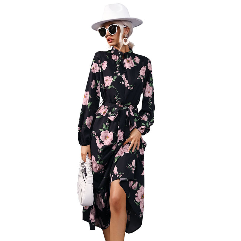 Women's maxi dress with floral allover print, stand collar, long balloon sleeves and ruffle detail.