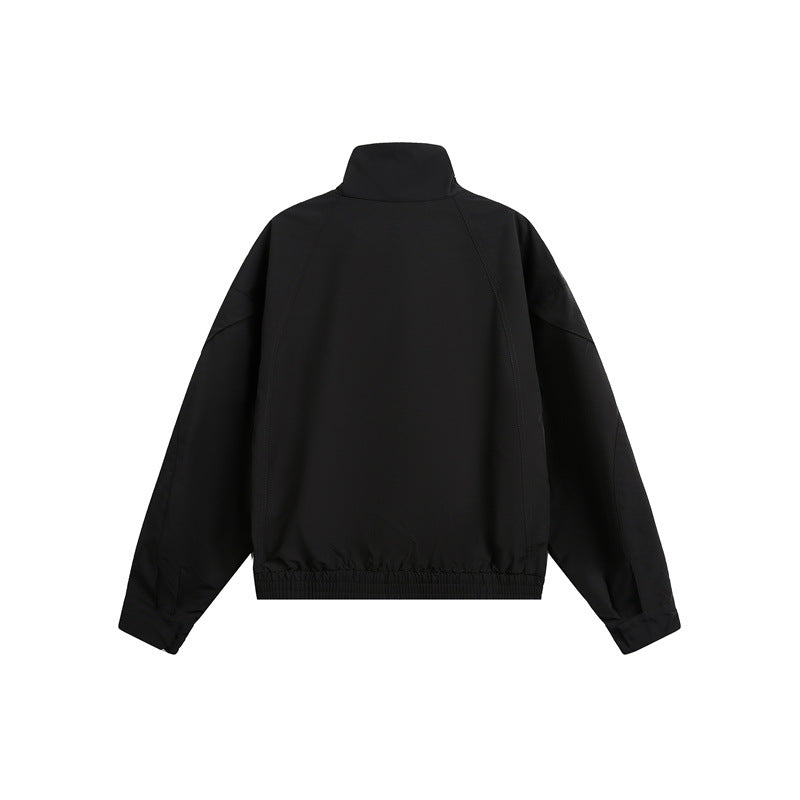 Unisex short jacket in minimalist tech fabric with funnel collar and concealed front placket Chichicherry