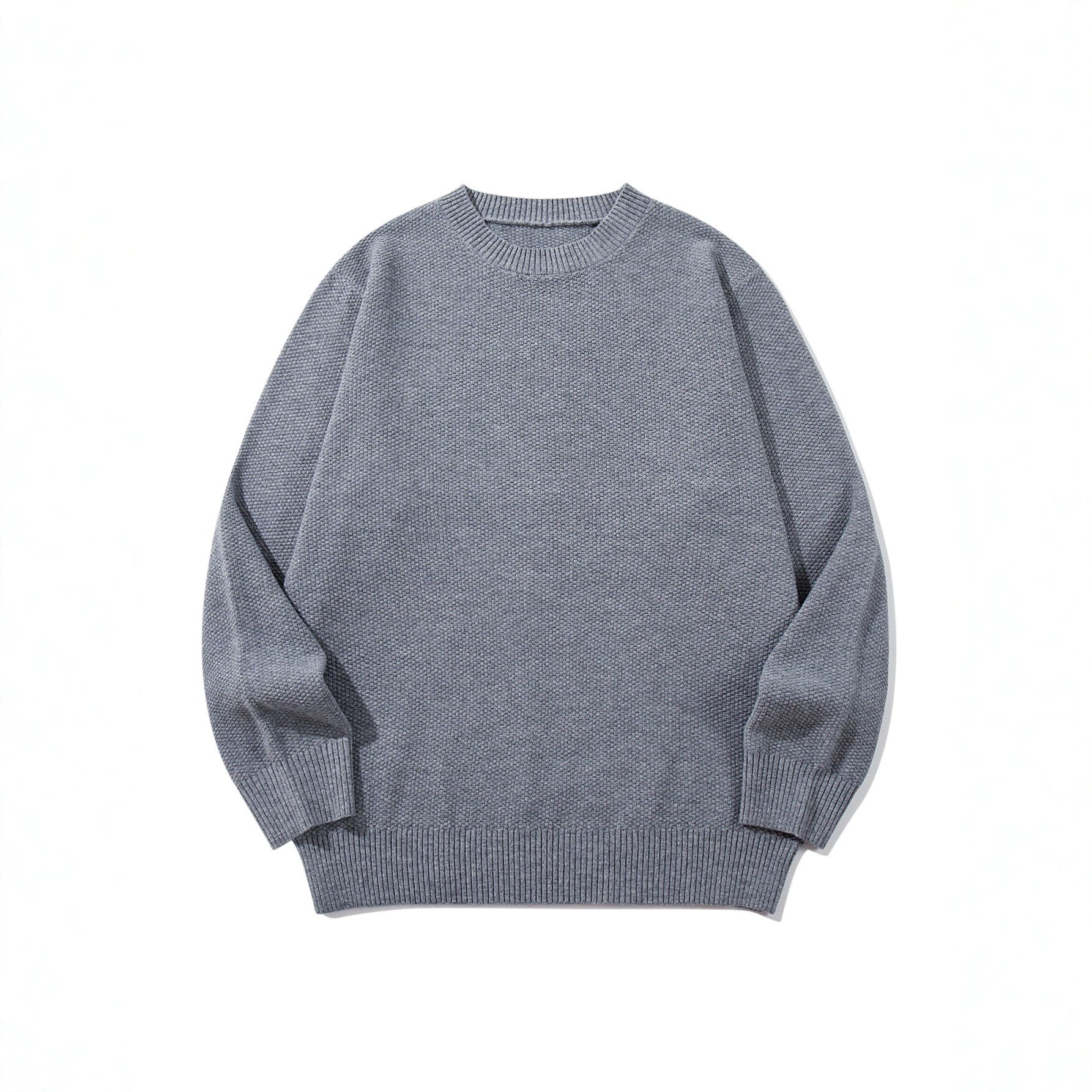 Unisex chunky knit round neck sweater with textured purl stitch and ribbed cuffs