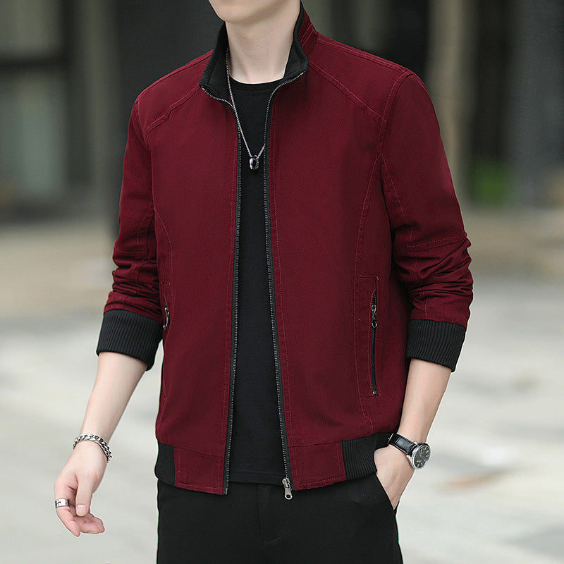 Men's slim-fitting micro canvas bomber with high stand collar, concealed zipper, and elastic ribbed cuffs.