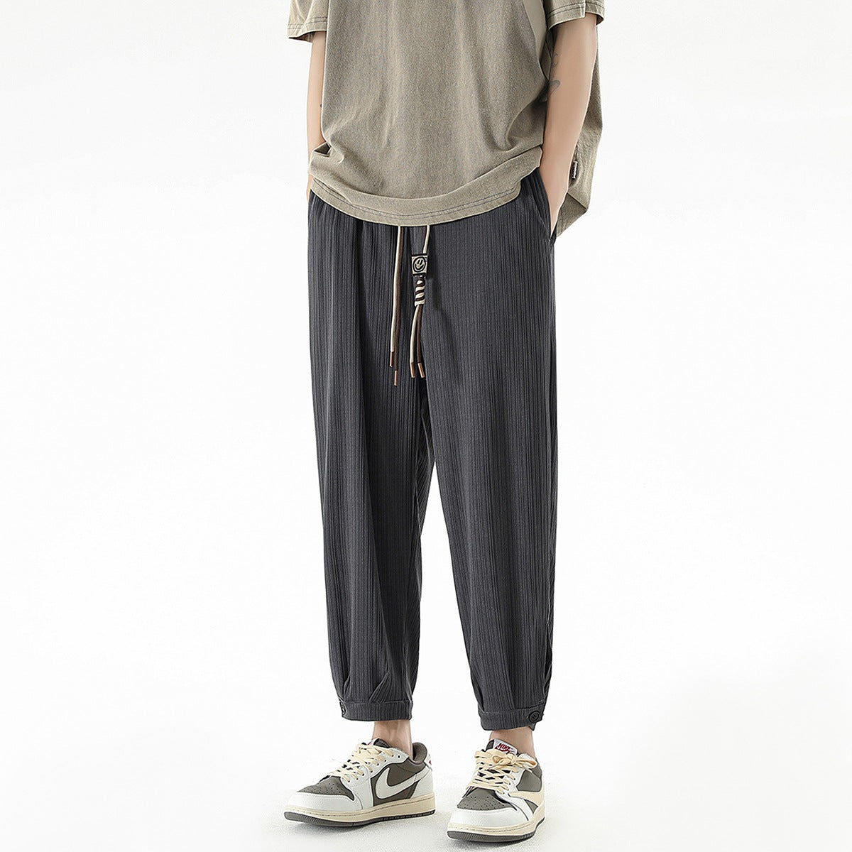 Men's loose-fitting leisure pants with drawstring, fine ribbed structure, and buttoned cuffs Chichicherry