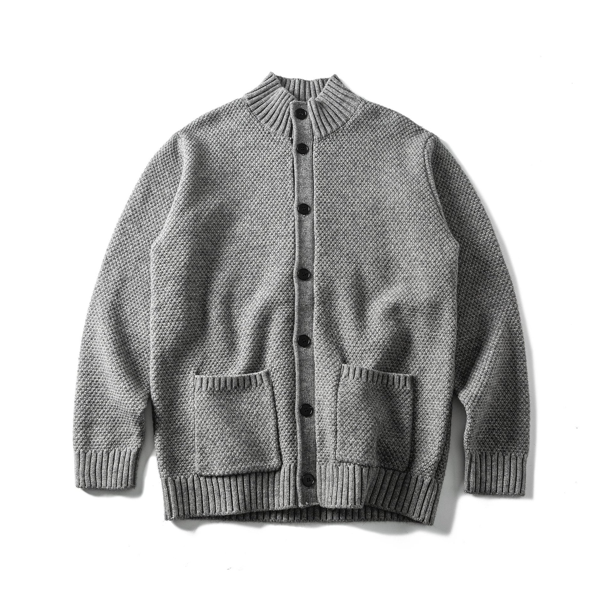 Women's bulky knit cardigan with high ribbed collar, button placket and patch pockets