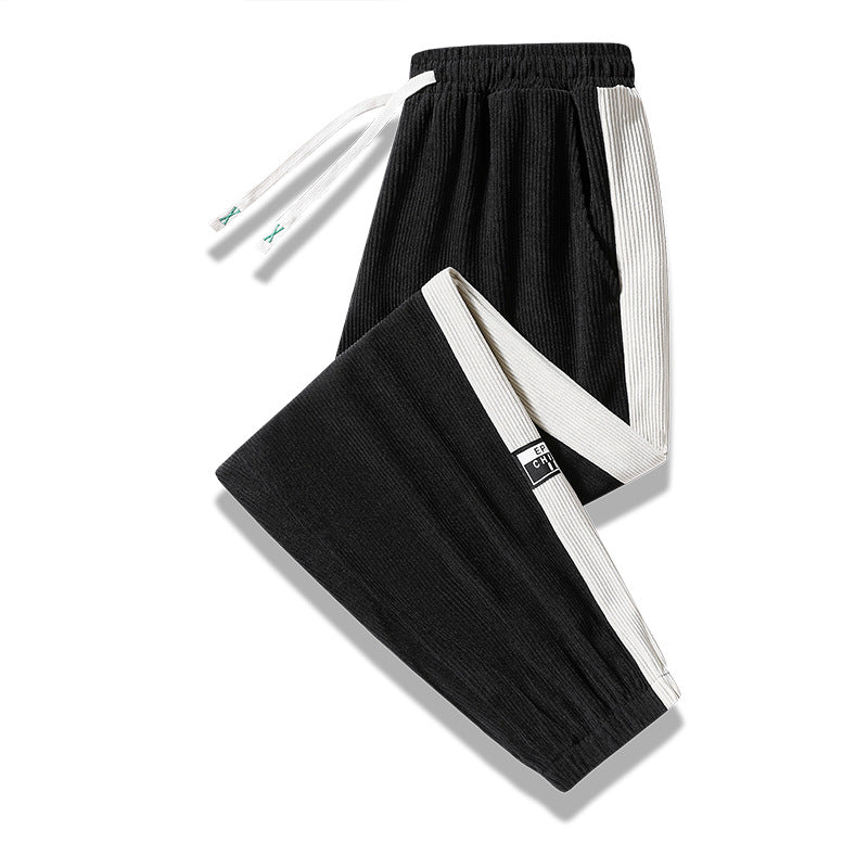 Men's jogging pants made of ribbed cotton blend with contrasting side inserts and elastic hem