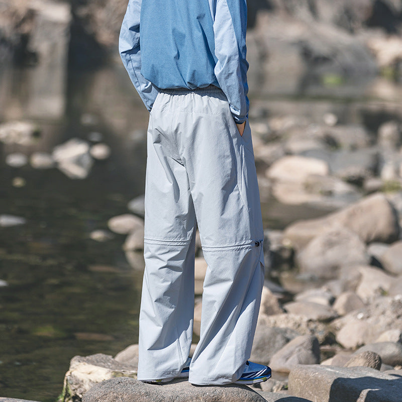 Men's loose technical cargo pants with drawstring, zipper pockets, and adjustable hem Chichicherry