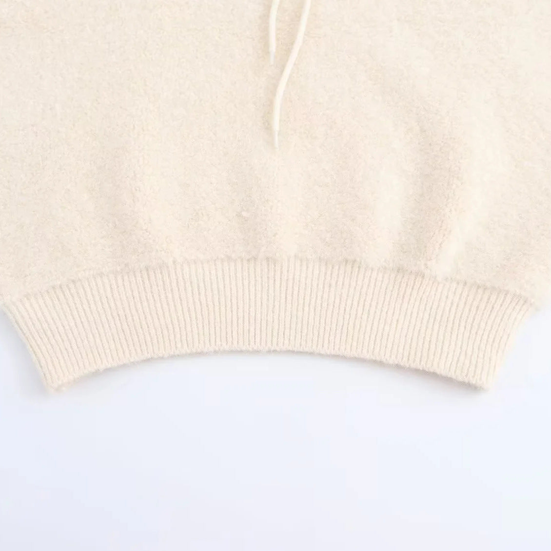 Women's sleeveless knitted vest with quilted hood and half zip Chichicherry