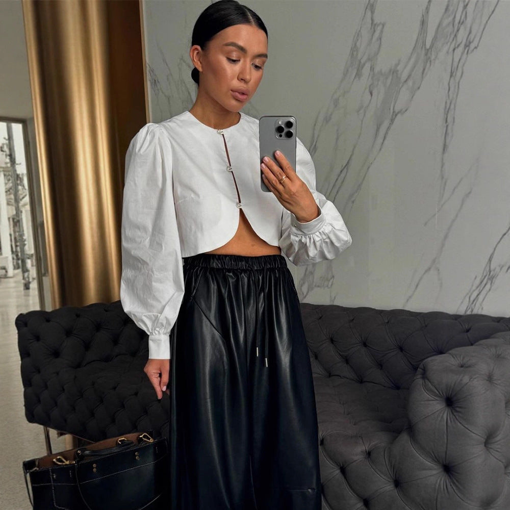 Women short-cut blouse with curved hem edge and voluminous puff sleeves Chichicherry
