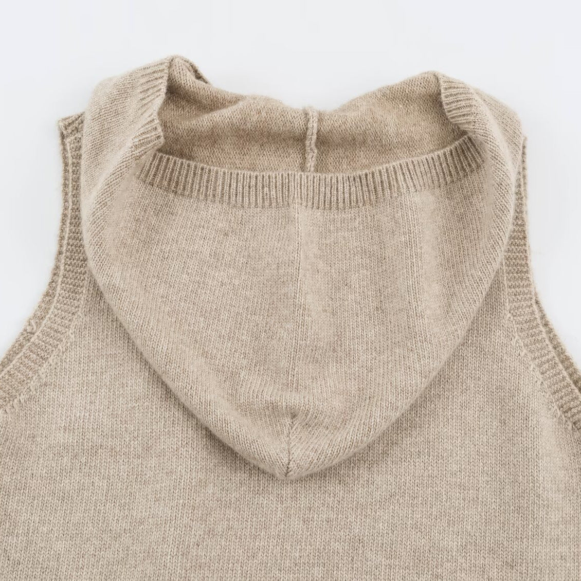Women's fine knit vest with hood, button placket, and ribbed waistband Chichicherry