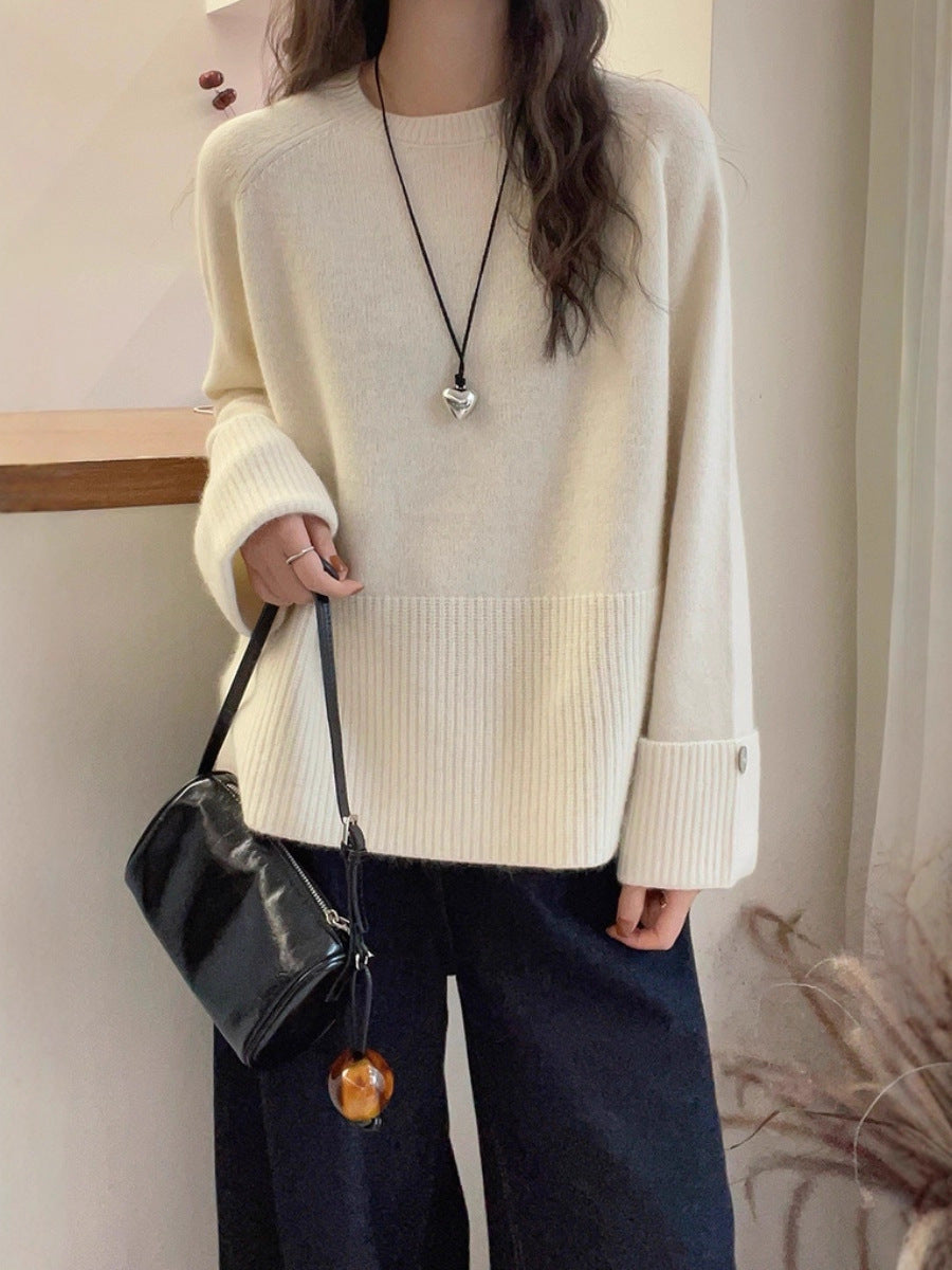 Women's oversized fine knit sweater with wide ribbed cuffs, extra wide sleeve endings, and decorative button Chichicherry