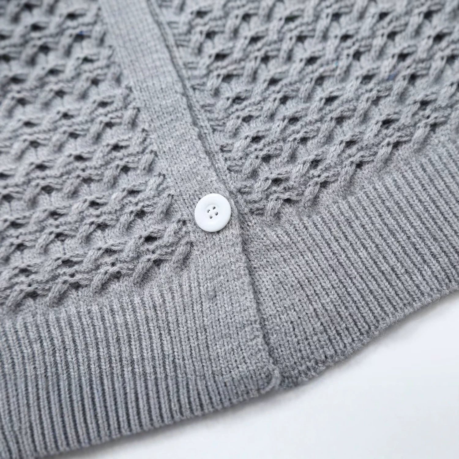 Women's structured cardigan with round yoke, textured stitch pattern and button placket Chichicherry