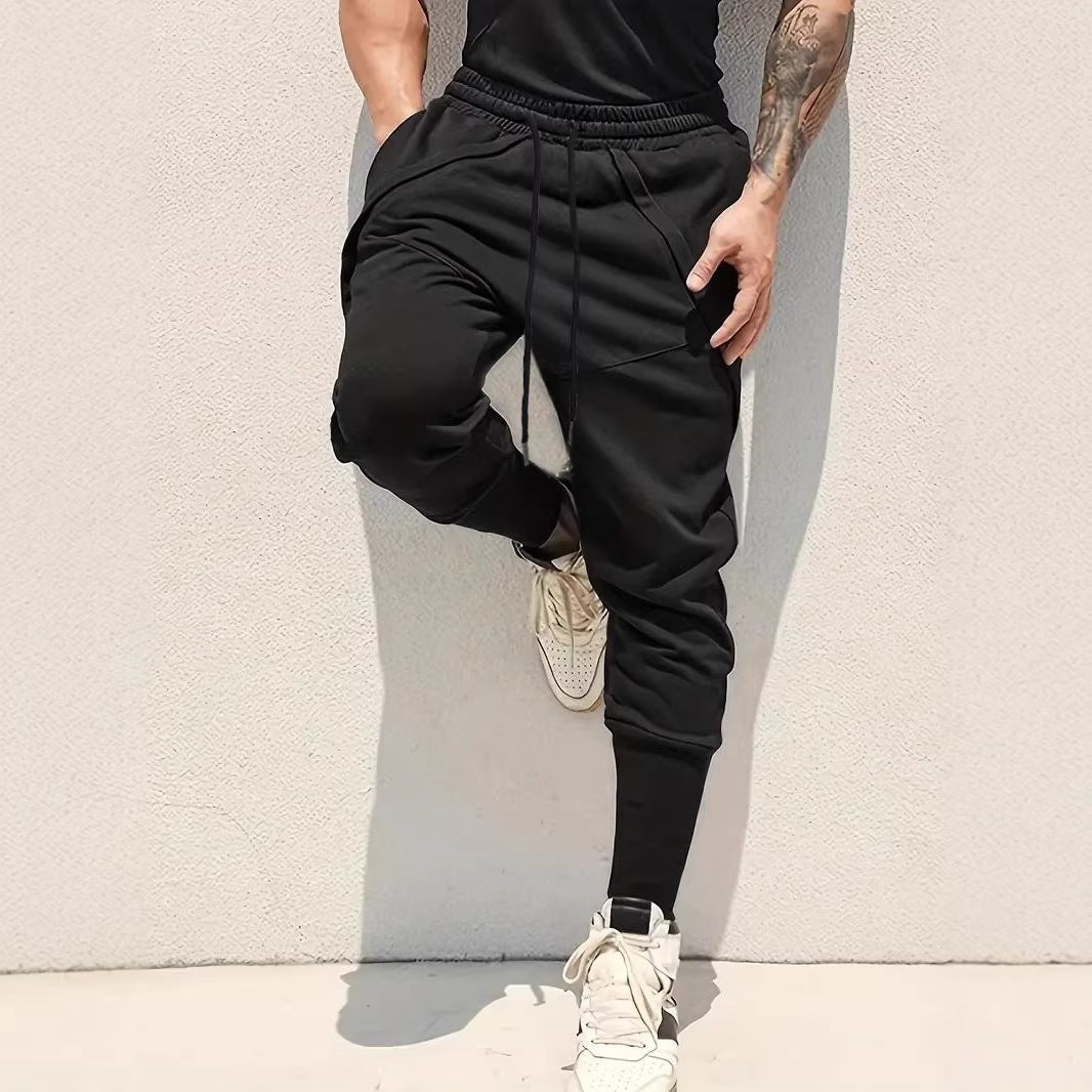 Men's Tapered Jogging Pants with Drop Crotch, Elastic Waistband & Diagonally Placed Pockets Chichicherry