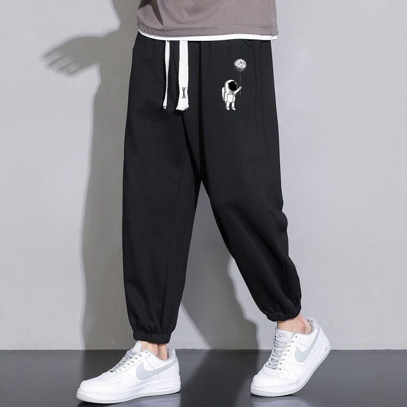 Men's Loose Jogging Pants with Astronaut Print, Drawstring Waistband and Elastic Cuffs Chichicherry