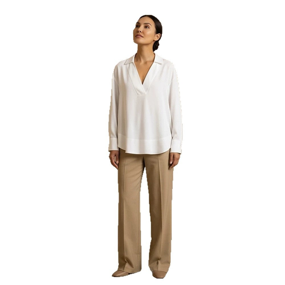 Women's loose-fitting tunic blouse with V-neck, shirt collar, and extended back hem Chichicherry