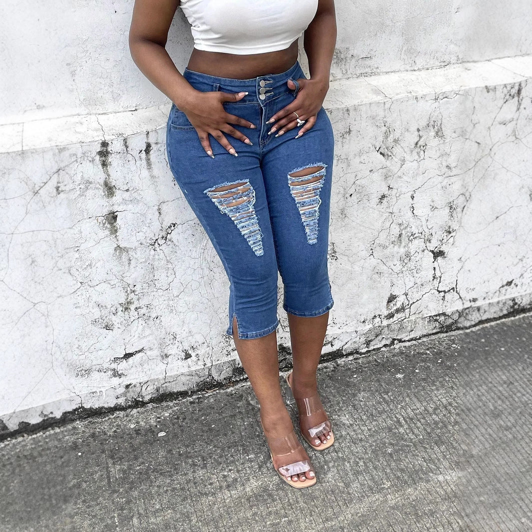 Women's high-waisted, three-quarter length stretch jeans with destroyed inserts and side seam slit Chichicherry