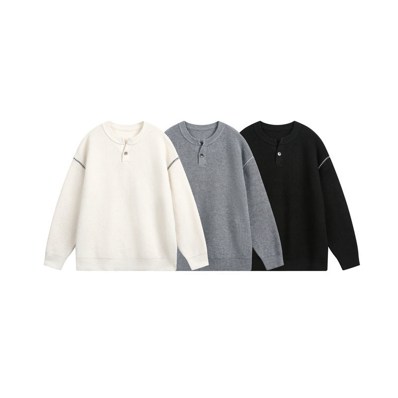 Unisex chunky knit henley pullover with button placket and drop shoulder drape