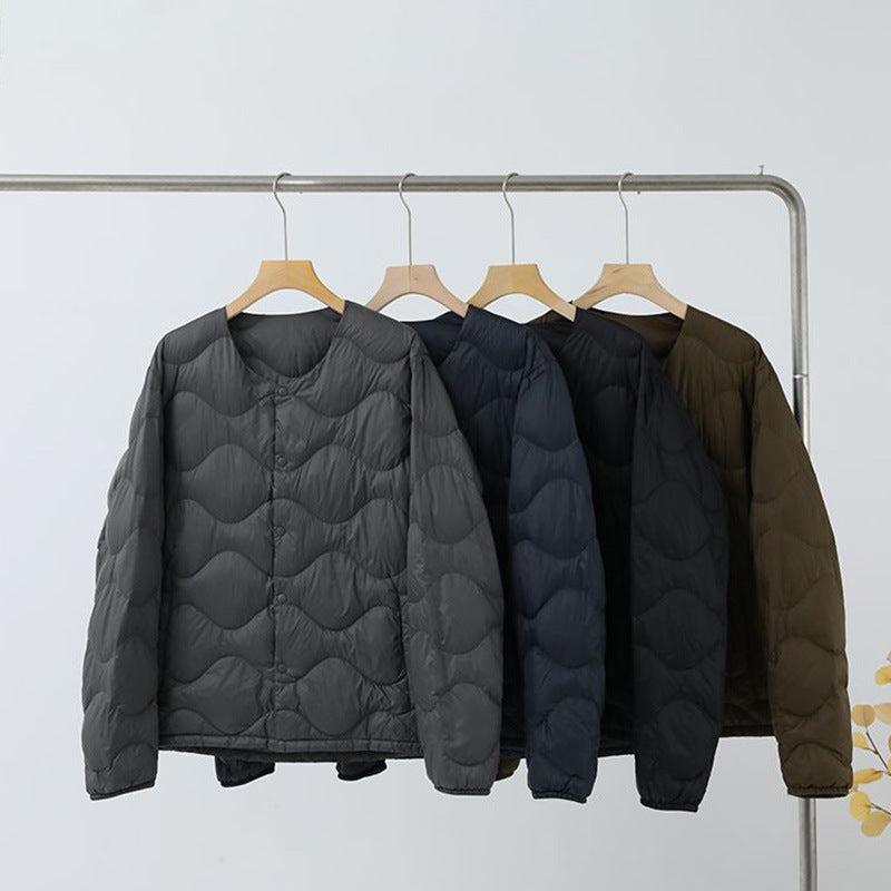 Women’s sleeveless thermal quilted vest with wave-shaped quilting and snap button closure Chichicherry