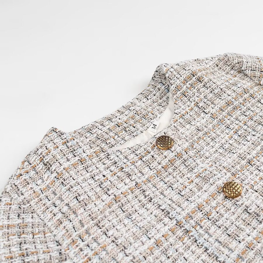 Ladies short jacket made of bouclé tweed with a round neckline and decorative gold buttons Chichicherry