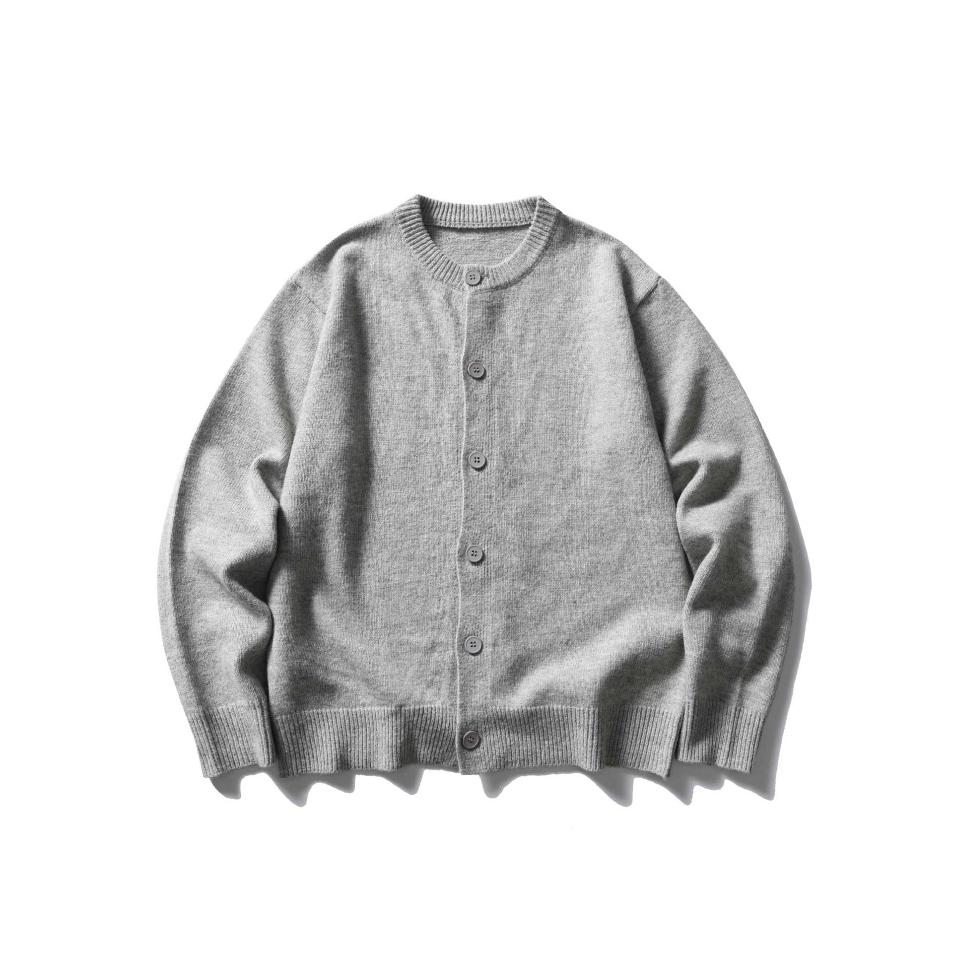Women's fine knit cardigan with round neckline, full button placket and wide ribbed cuffs.