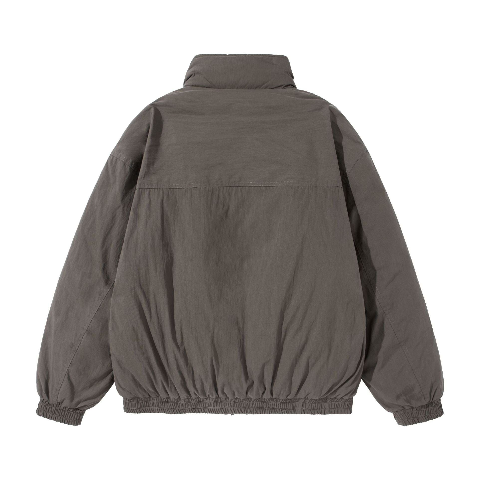 Unisex Short-cut quilted boxy blouson jacket with high stand-up collar and utility flap pockets Chichicherry