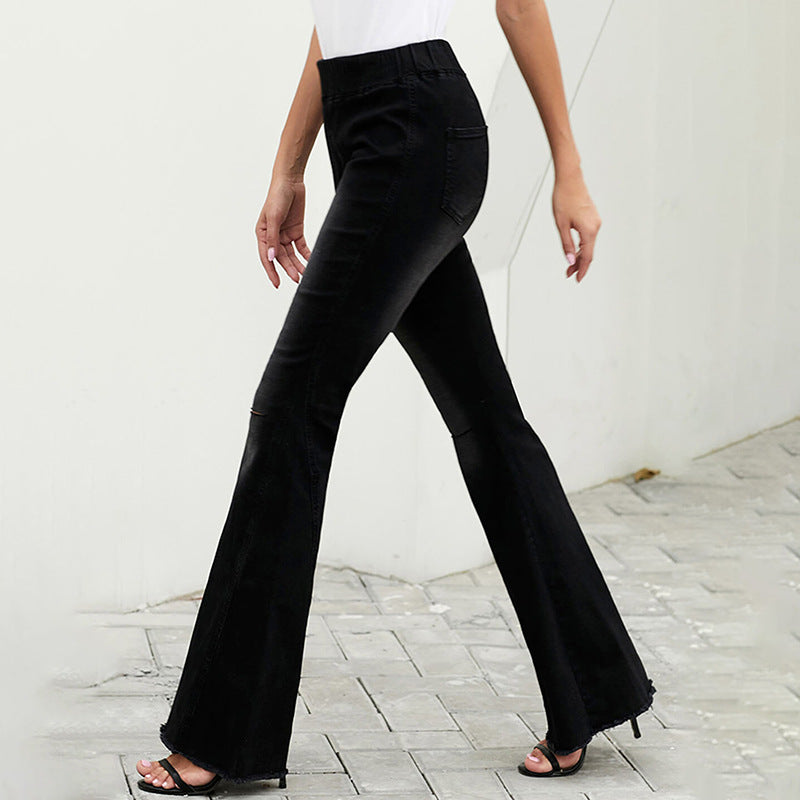 Women's high-waisted flared denim pants with elastic drawstring waistband, decorative seams, and raw hem Chichicherry