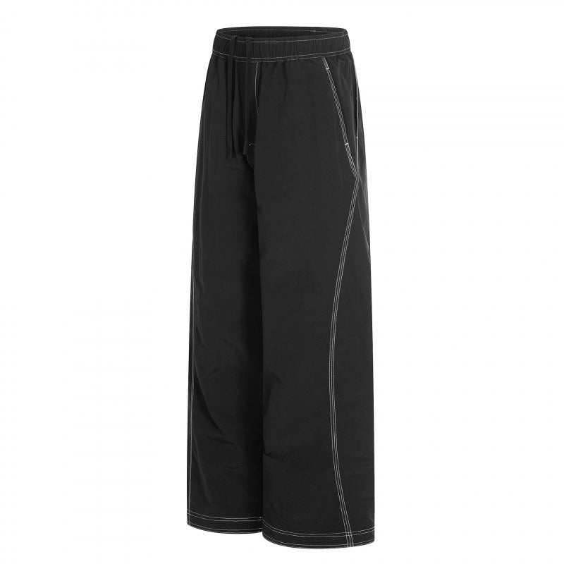 Women's wide pants with elastic waistband, drawstring and contrasting decorative seams Chichicherry