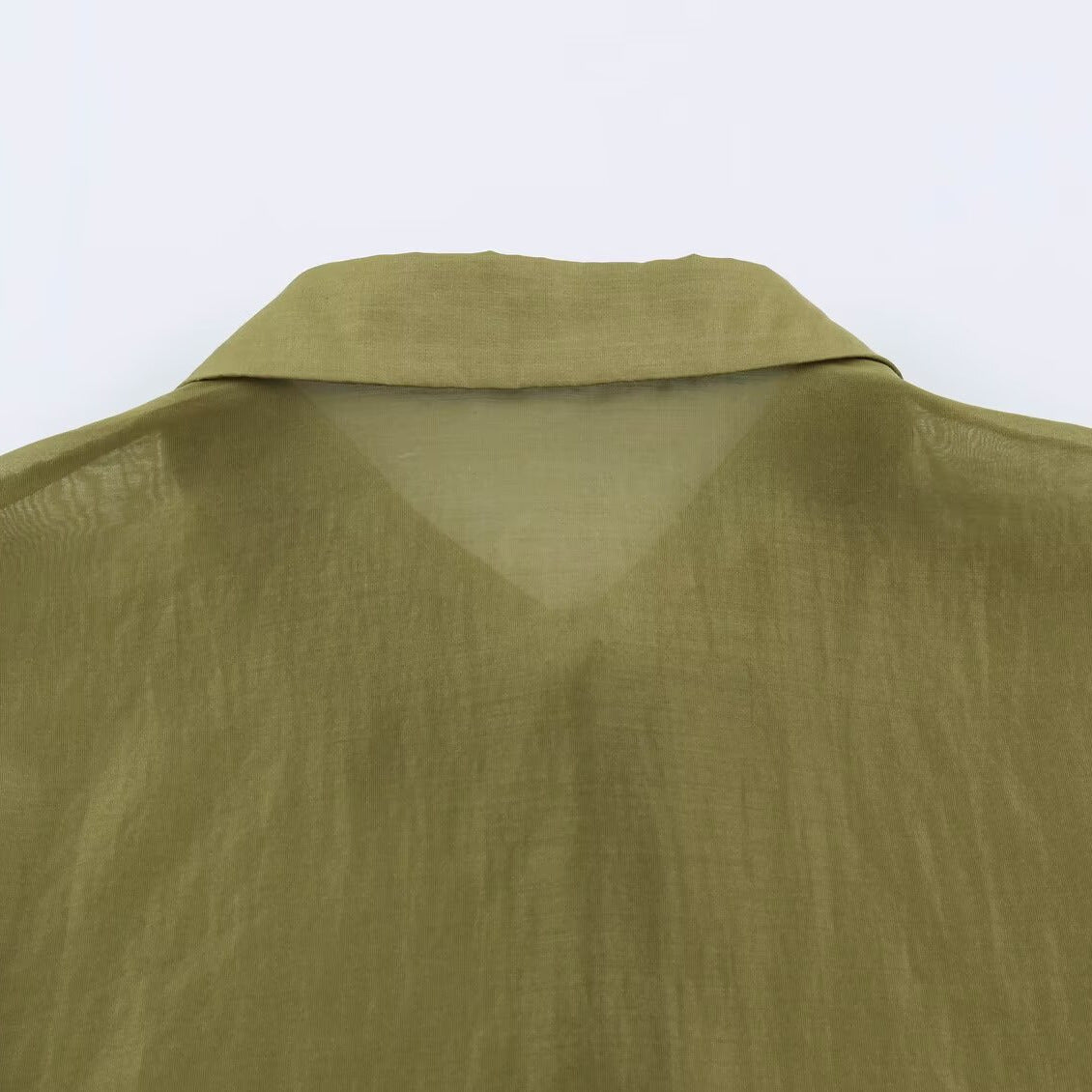 Women's silk effect blouse with voluminous sleeves, layered ruffles, and smocked cuffs