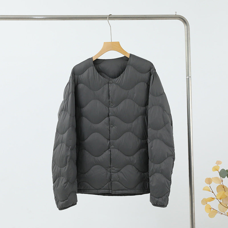 Women’s sleeveless thermal quilted vest with wave-shaped quilting and snap button closure Chichicherry