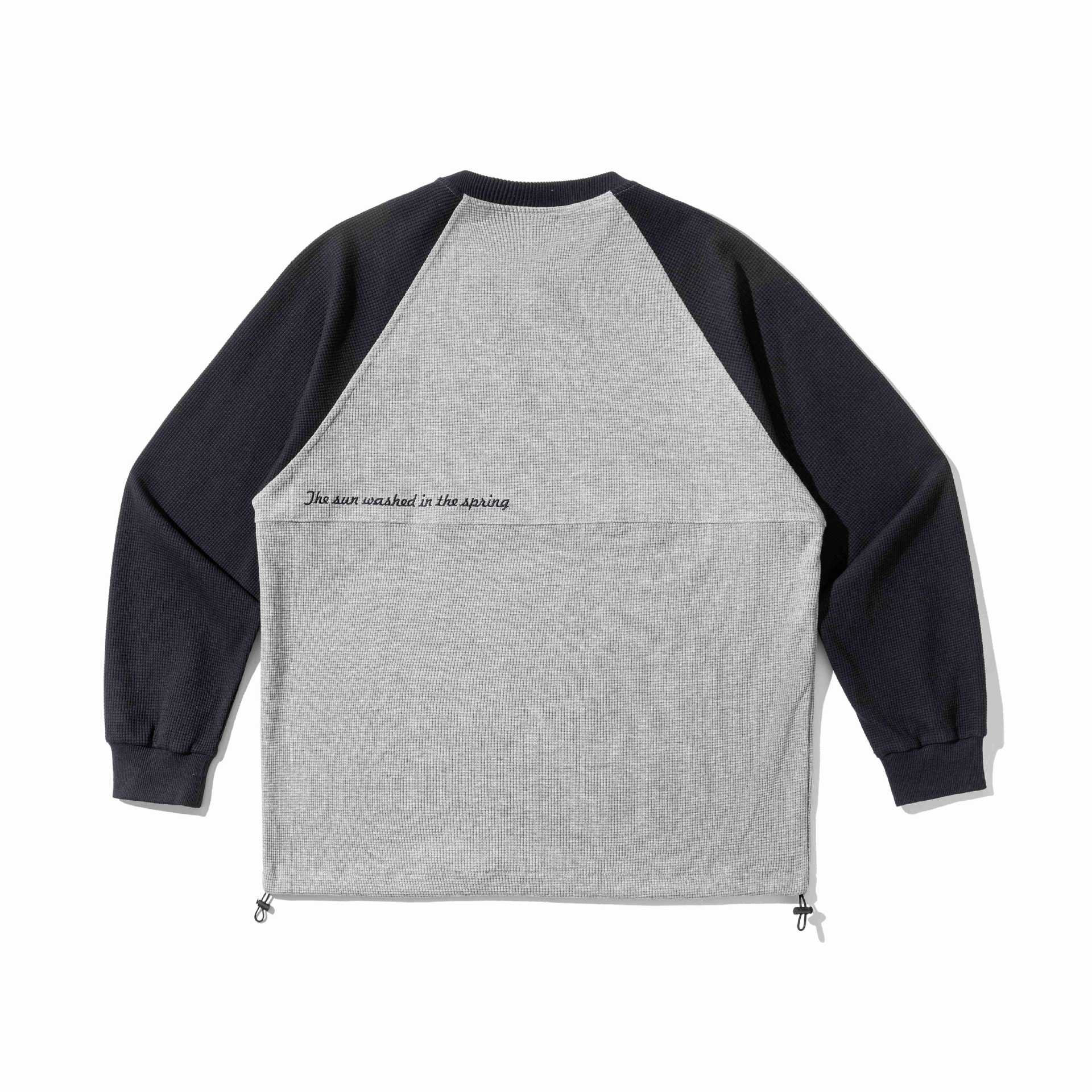 Unisex Raglan sweatshirt with thermo waffle texture, drawstring hem and subtle chest embroidery Chichicherry