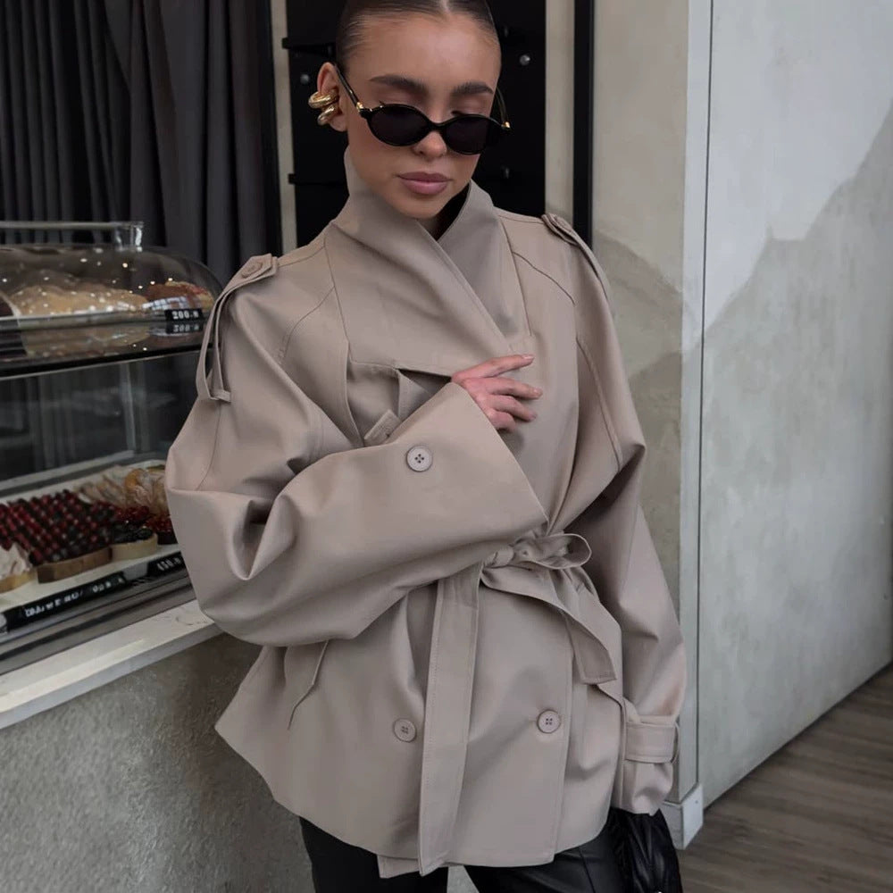 Women's short trench coat with wide standing collar, shoulder epaulettes, and waist belt Chichicherry