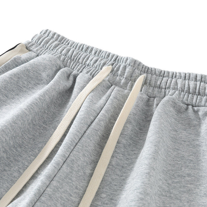 Men's loose-fitting joggers with elastic waistband, drawstring, and contrasting side stripes Chichicherry