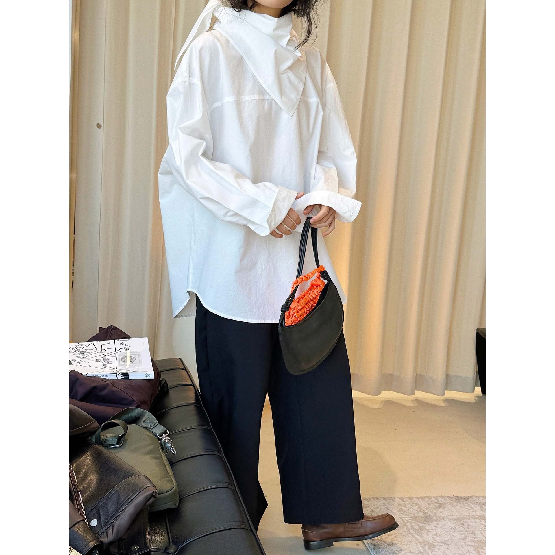 Women loosely cut cotton blouse with wrapped shawl collar and wide cuffs