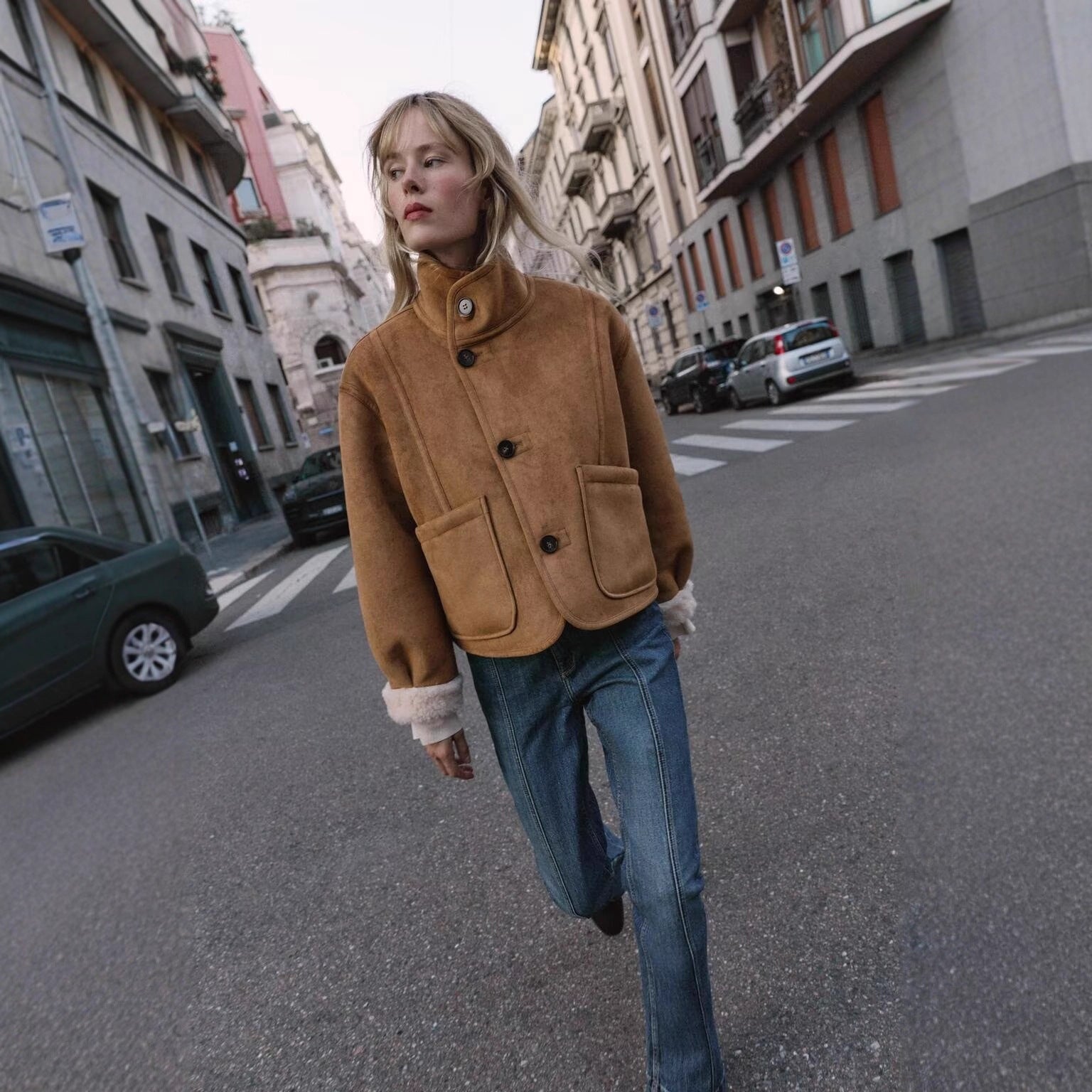 Women's short jacket in lambskin look with stand-up collar, patch pockets, and button placket Chichicherry