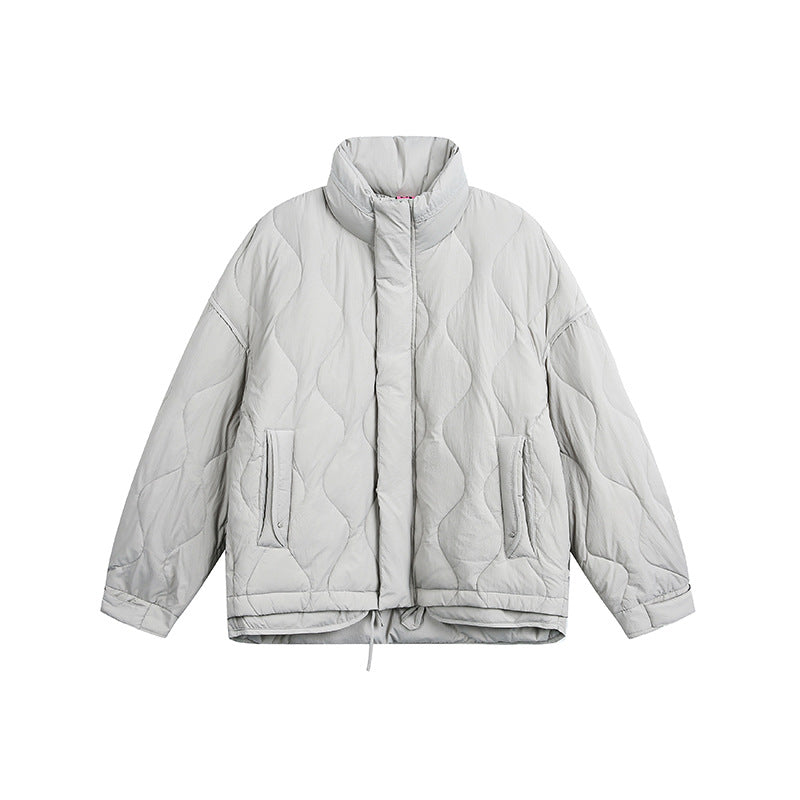 Women's oversized quilted jacket with stand-up collar, wave quilting, and drawstring hood