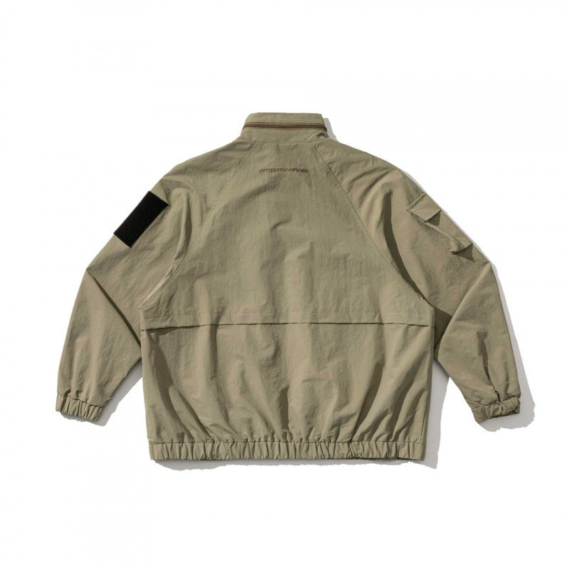 Unisex Oversize Utility Jacket with multifunctional pockets, high stand-up collar, and elastic hem Chichicherry