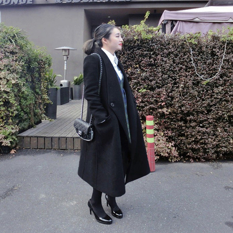 Women's midi-length tailored wool blend long coat with shawl collar, inset pockets, and discreet decorative buttons Chichicherry