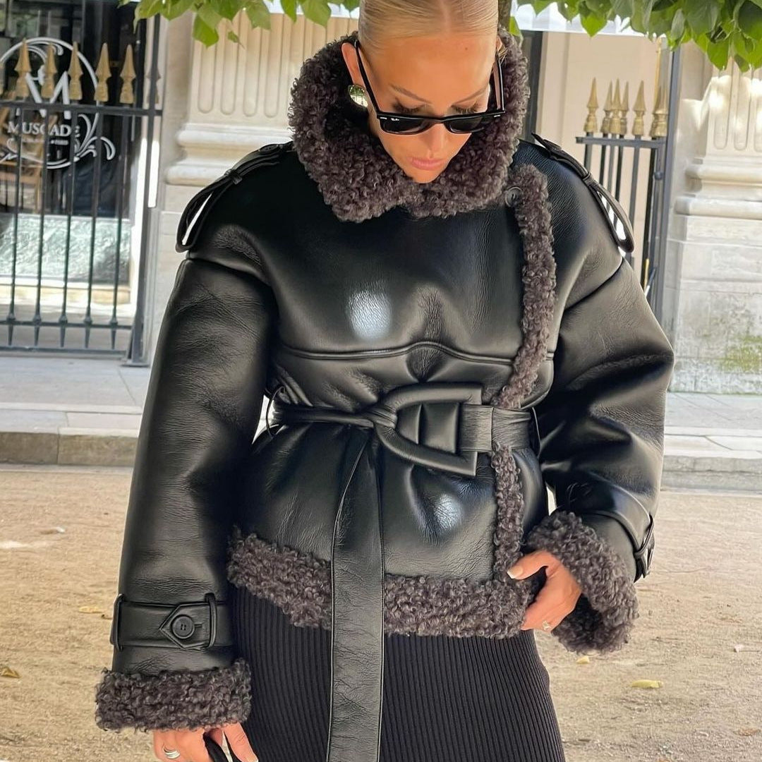 Women Short Flight Jacket Made of Faux Leather with Teddy Fur Collar and Waist Belt Chichicherry