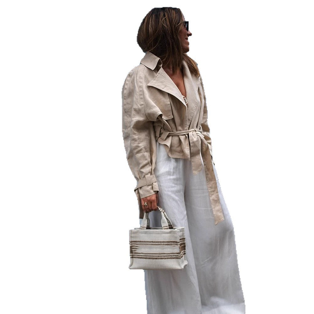 Women’s short trench coat with waist knot detail, cape sleeves, and boxy cropped cut Chichicherry