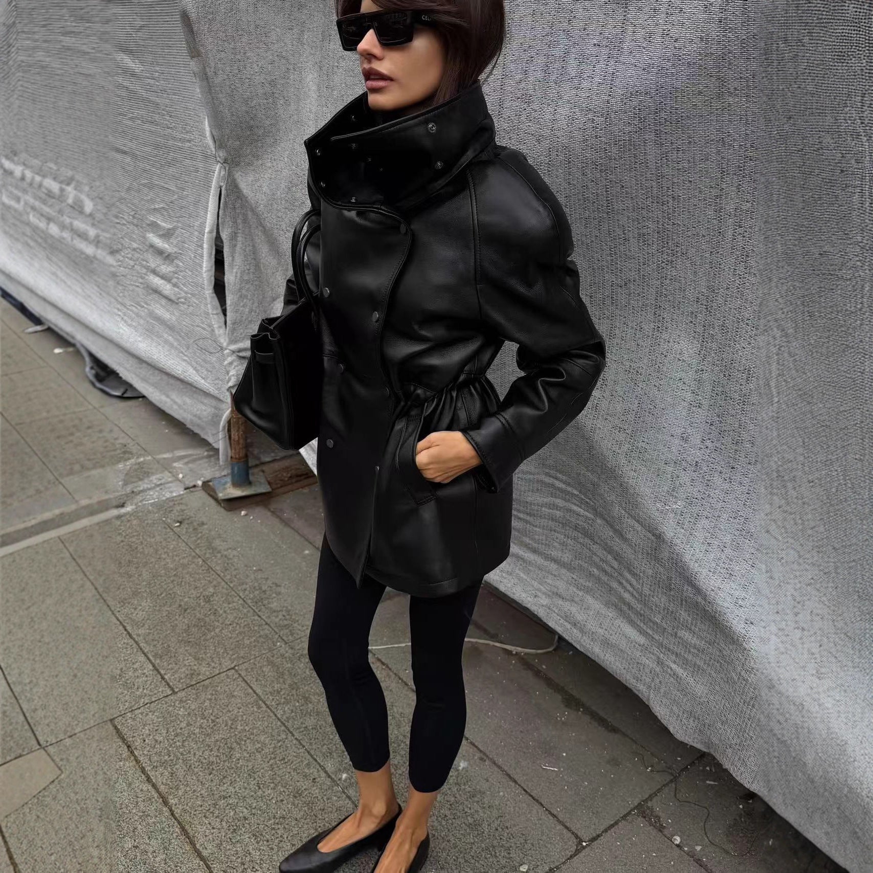 Women's rain jacket made of leather look with high stand-up collar, waist drawstring and snap button front Chichicherry