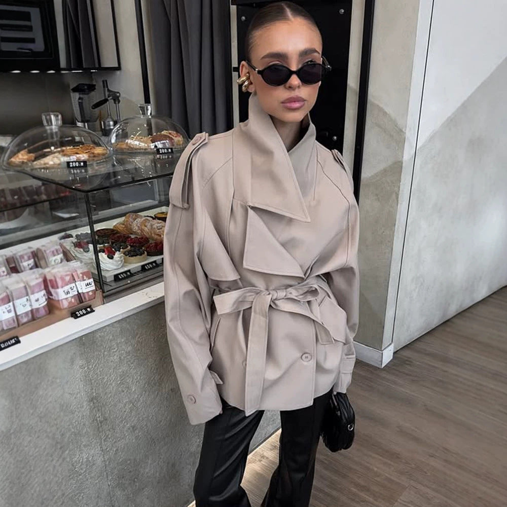 Women's short trench coat with wide standing collar, shoulder epaulettes, and waist belt Chichicherry