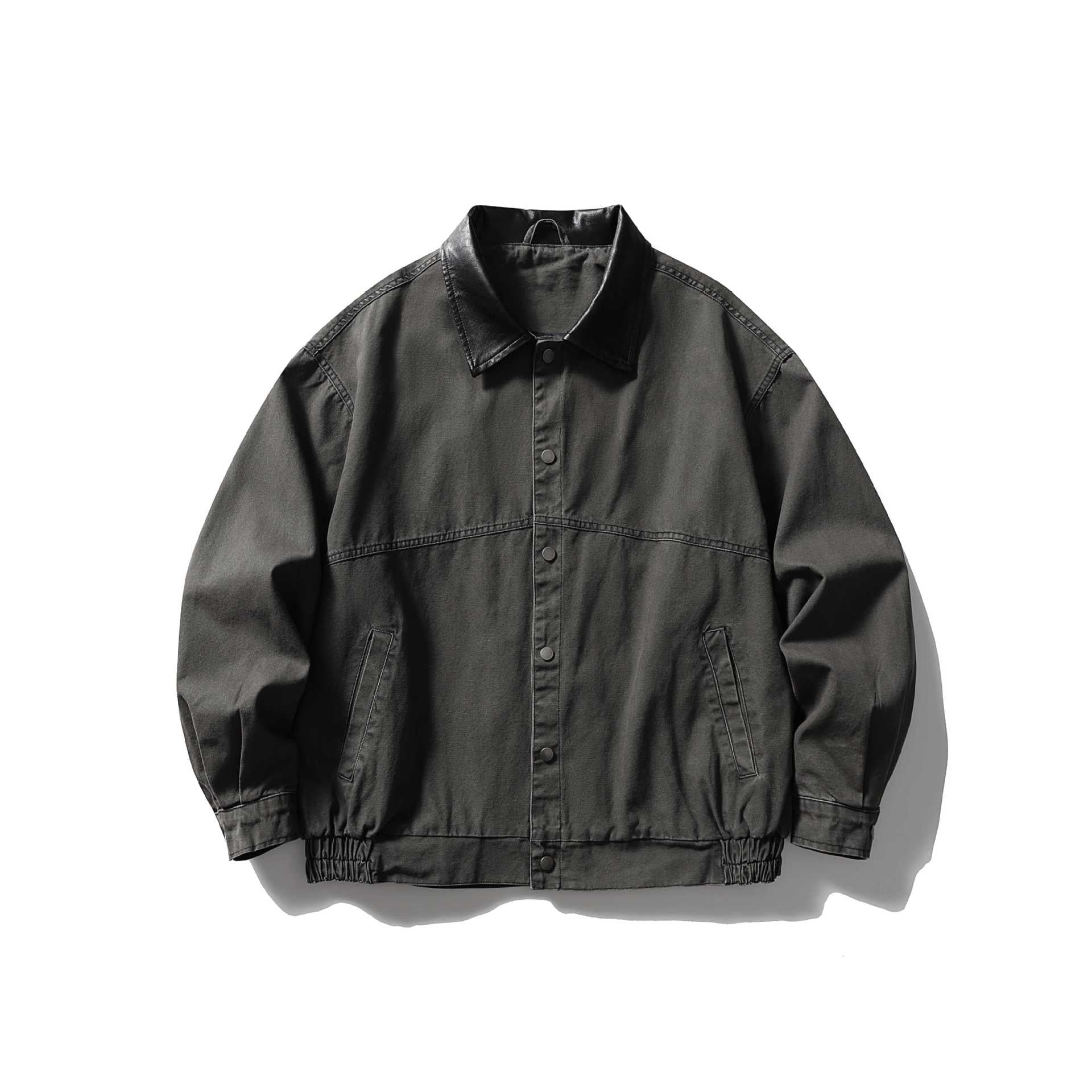 Men's tailored canvas blouson with contrasting leather collar and elastic hem.