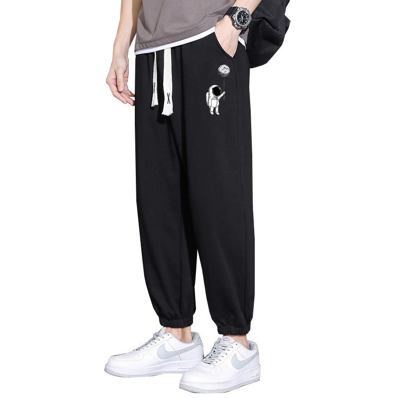 Men's Loose Jogging Pants with Astronaut Print, Drawstring Waistband and Elastic Cuffs Chichicherry