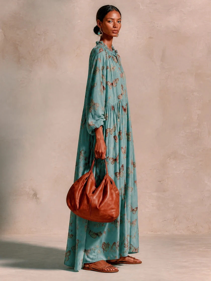 Women’s maxi dress in boho caftan style with butterfly print and gathered empire waist drape