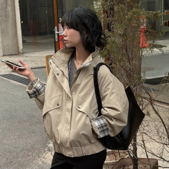 Women’s short bomber jacket with stand-up collar, chin strap, and checkered sleeve lining Chichicherry