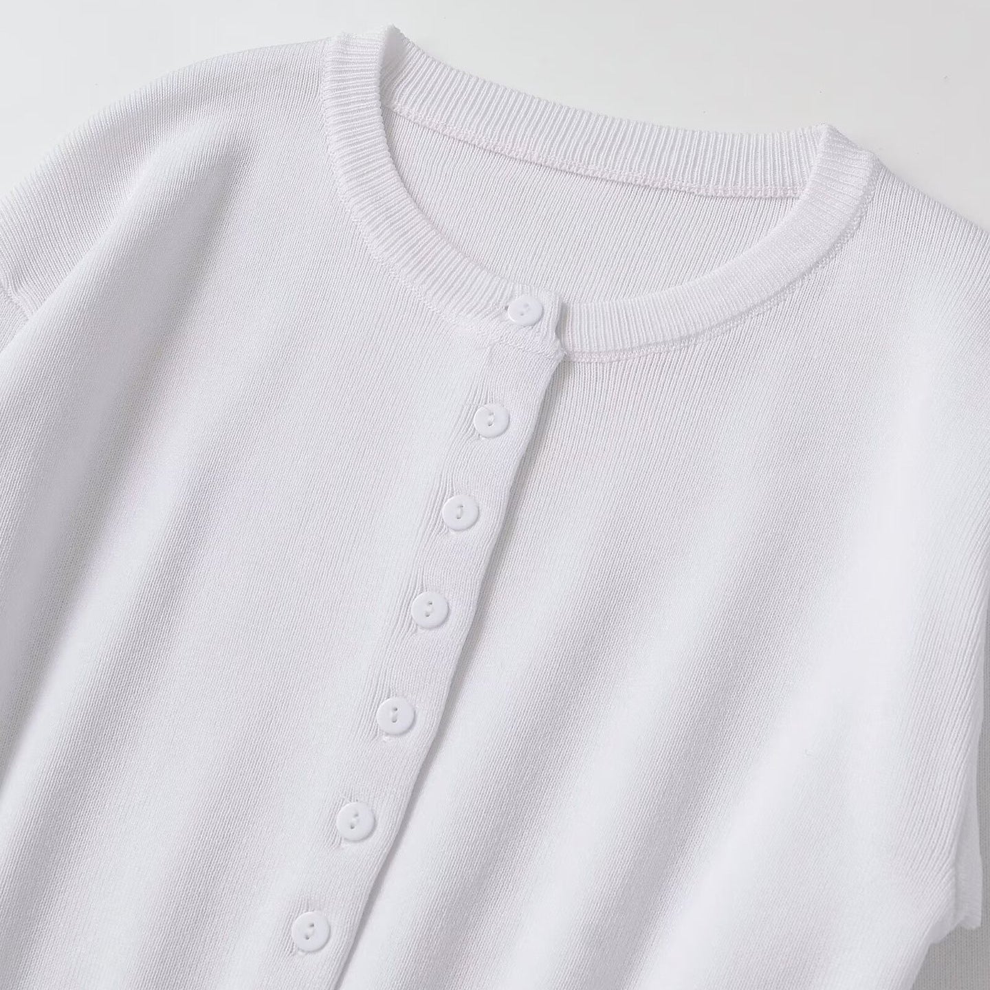 Women's Short Fine Knit Cardigan with Tailored Ribbed Waistband and Continuous Button Placket Chichicherry