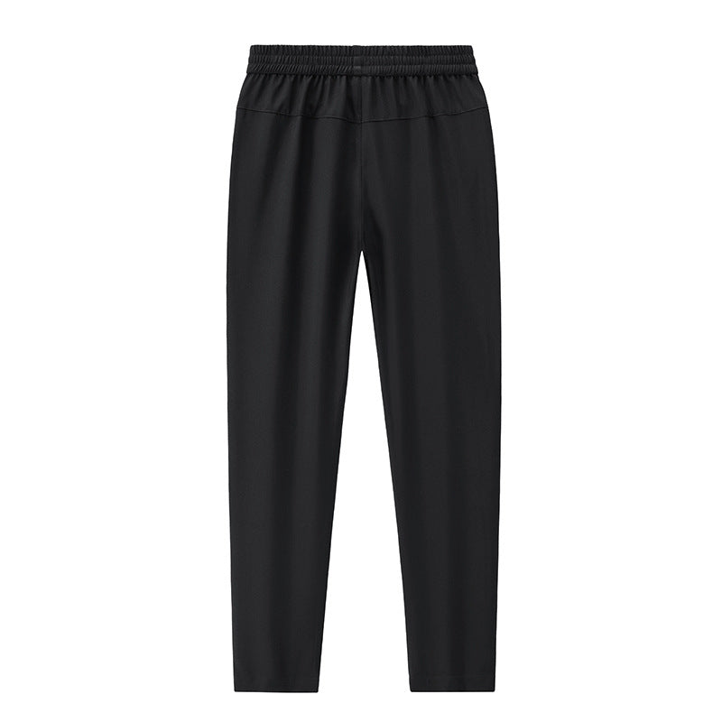 Men's Sportive Tapered Jogging Pants with Elastic Waistband, Zipper Pockets and Breathable Functional Material Chichicherry