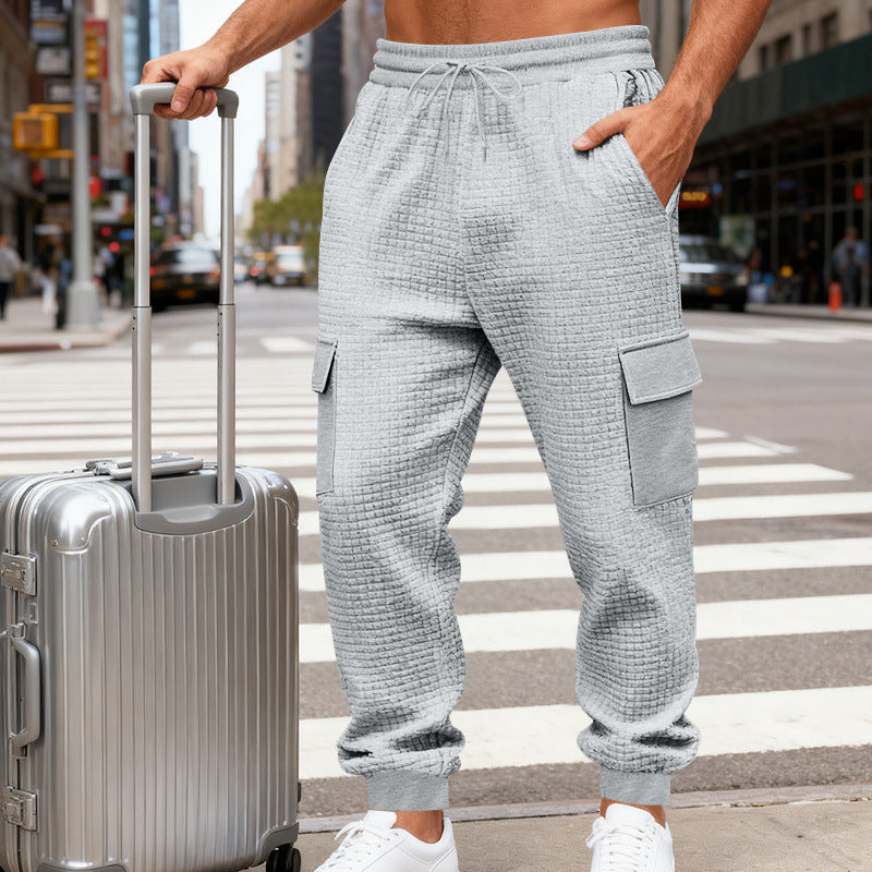 Men's cargo joggers with distinctive waffle texture, elastic waistband, and large flap pockets Chichicherry