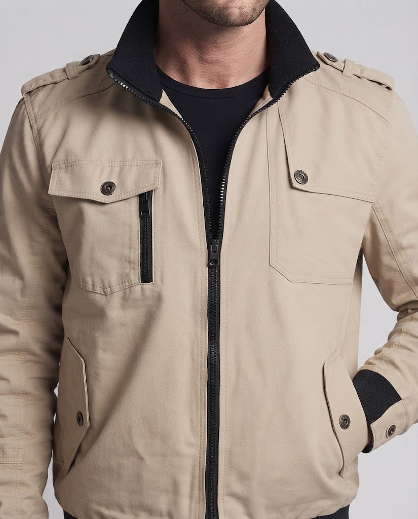 Men's short jacket in utility field design with stand-up collar, shoulder epaulettes, and concealed zip pockets Chichicherry