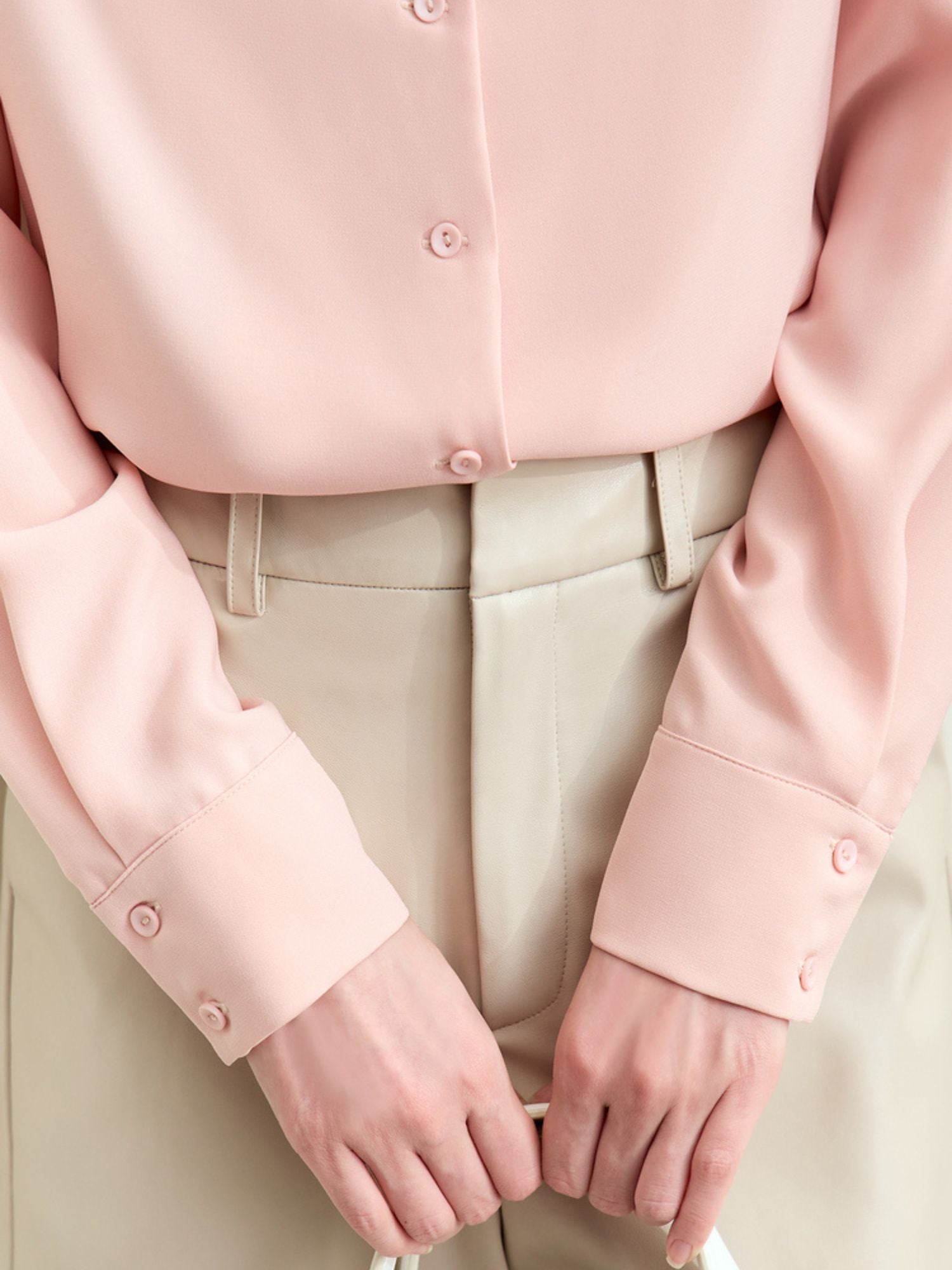 Close-up detail of pink blouse’s front 