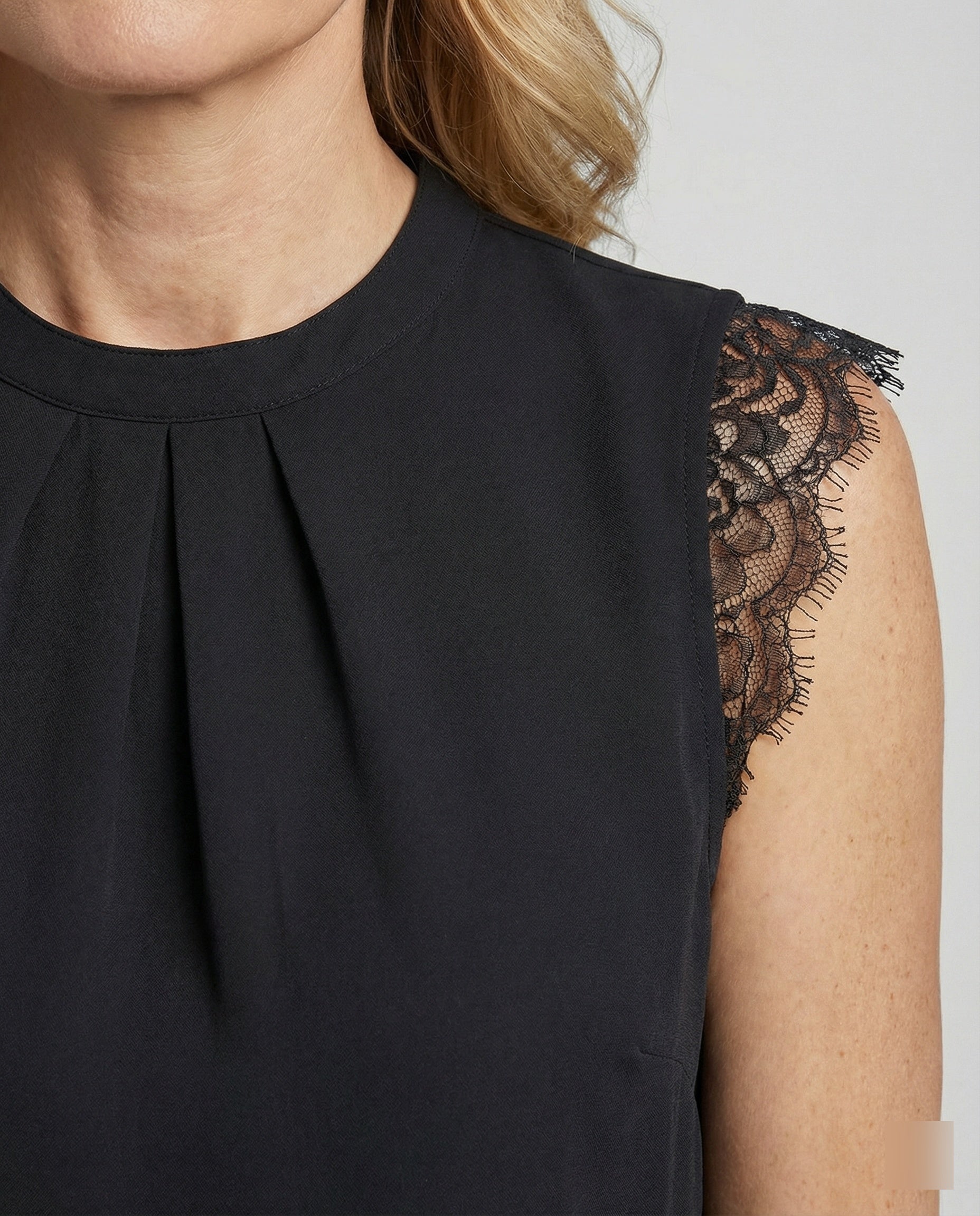 Sleeveless lace blouse women with round neckline