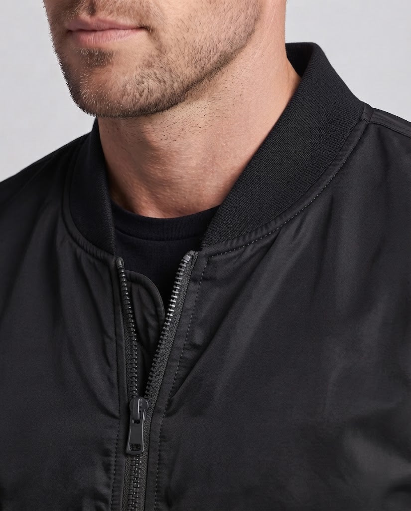 Men's technical nylon flight bomber with padded interior, arm pocket and elastic ribbed cuffs Chichicherry