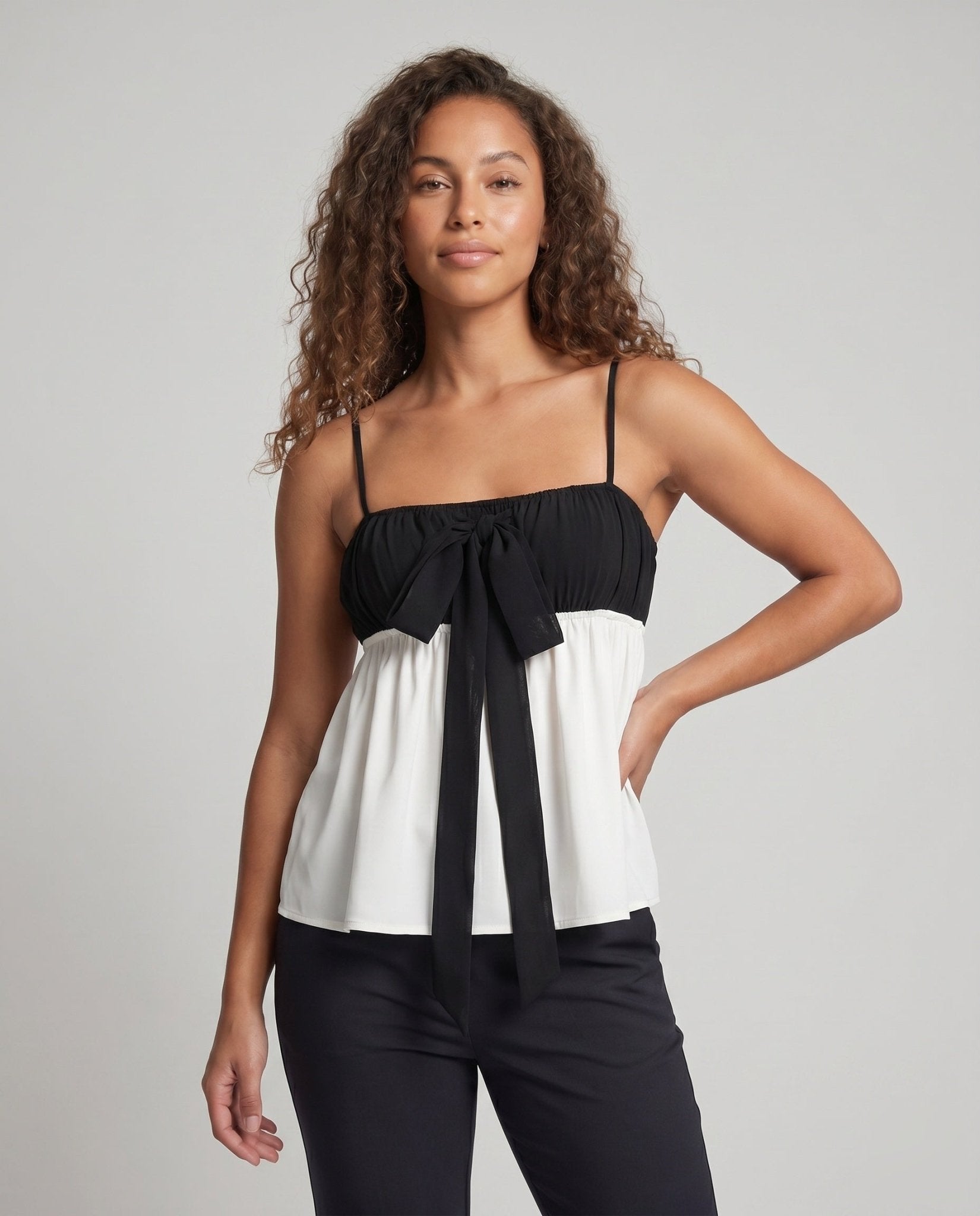 Ladies Charming Tank Top with Bow Accent and Flowing Hem - Chichicherry